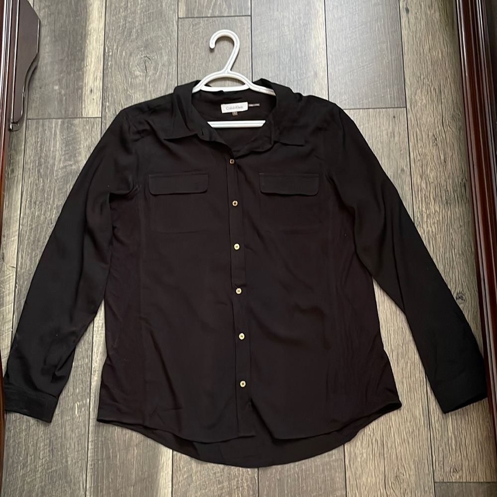 Black shirt from Calvin Klein , it is in good condition.